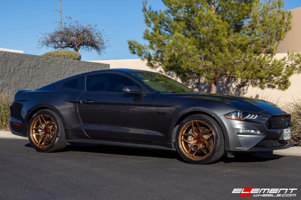 20 inch Staggered Variant Xenon Brushed Bronze w/ Blood Red Center Cap on a 2019 Ford Mustang GT