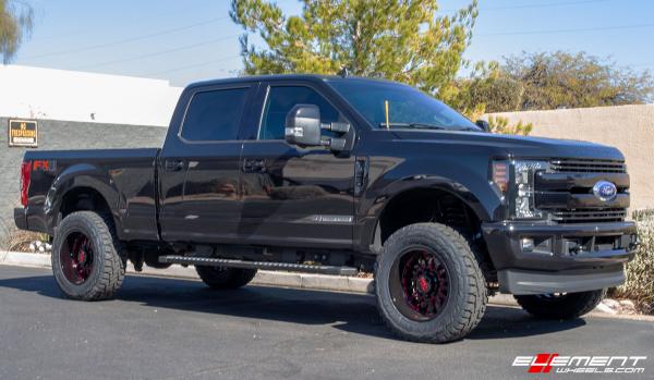 20 inch Cali Off-Road Summit 9110 Gloss Black w/ Red Milled Spokes on a 2019 Ford F-250