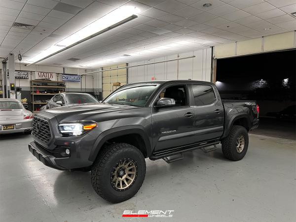17 inch ICON Compression Bronze on a Lifted 2021 Toyota Tacoma TRD